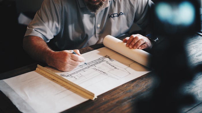 Technical drawings and plans spread on a desk